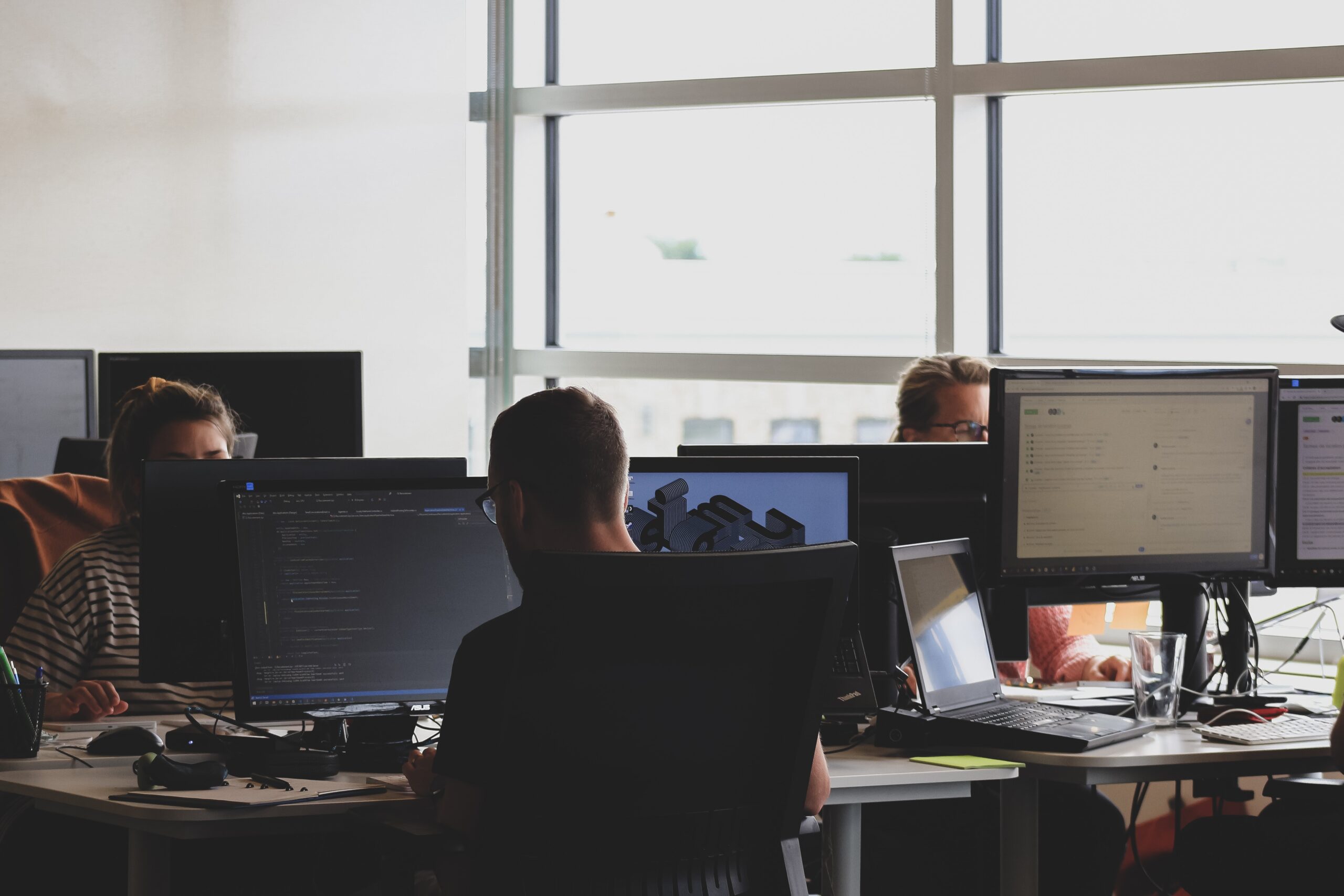 man working on computer in an office